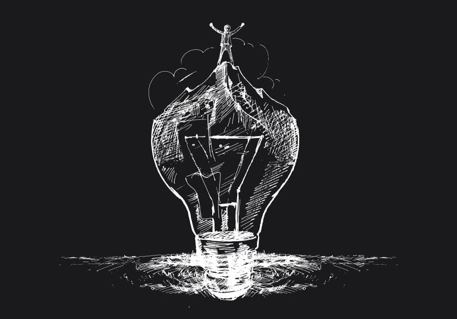A conceptual white chalk-style illustration on a black background featuring a large lightbulb. Inside the lightbulb, a mountain peak is visible, with a triumphant human figure standing at the very top with arms raised in success. The image symbolizes the intersection of brilliant ideas, brand vision, and reaching the peak of business success through strategic visual identity.